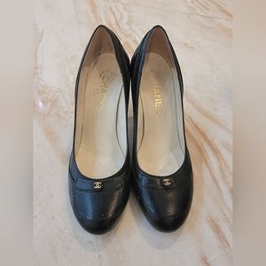 Chanel black leather pumps